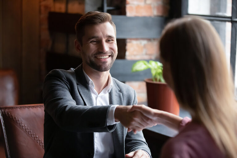 bigstock Smiling Man Executive Greeting 383050724