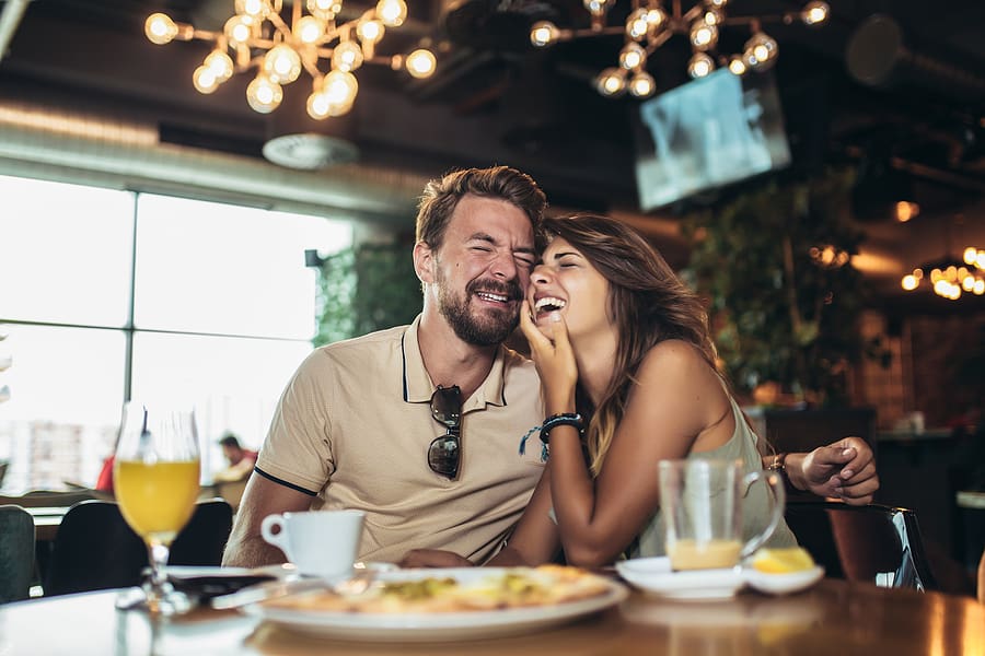 bigstock Young Happy Couple Eating Pizz 333383146