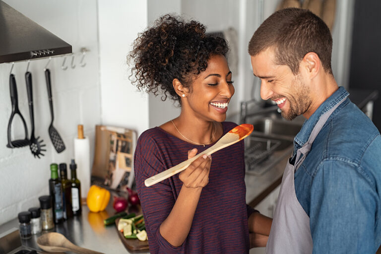 bigstock Young couple tasting tomato sa 335802952