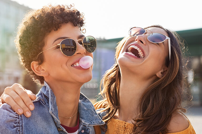 bigstock Young latin woman laughing whi 298599409