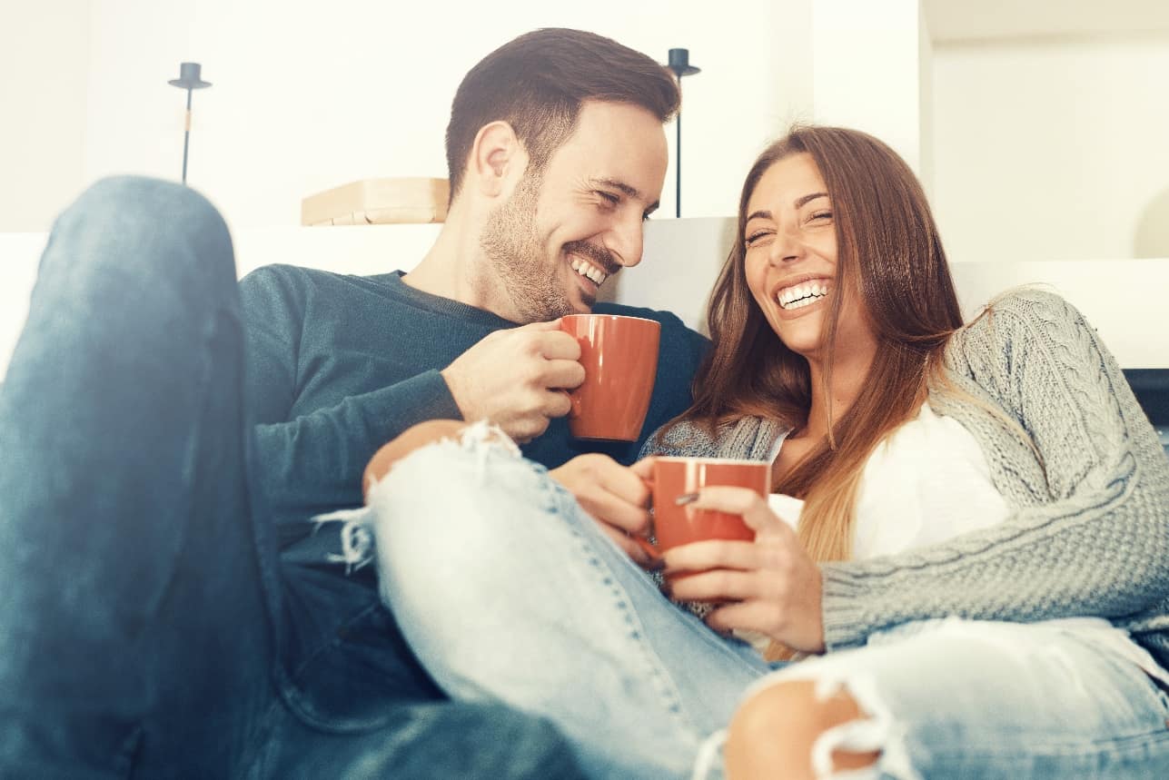 couple with red mugs