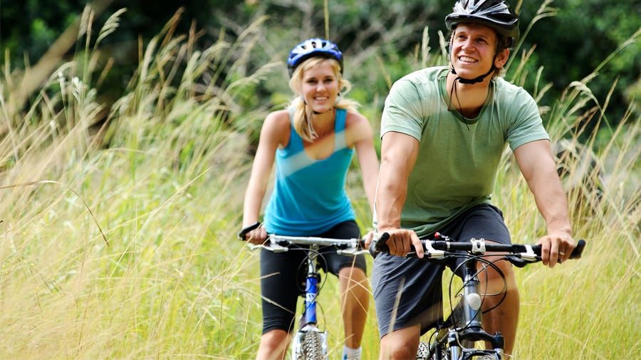 happy-couple-bik-riding happy-couple-bik-riding