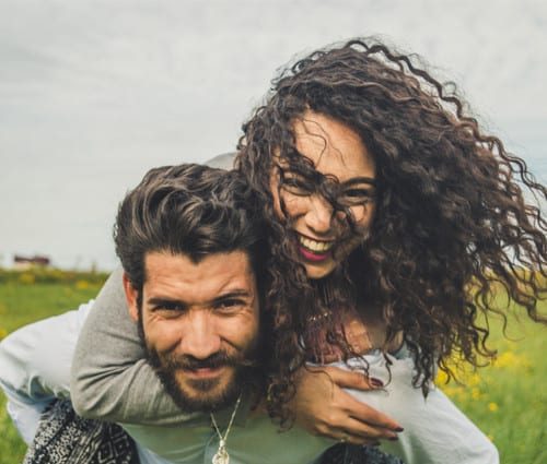 happy-couple-in-field happy-couple-in-field