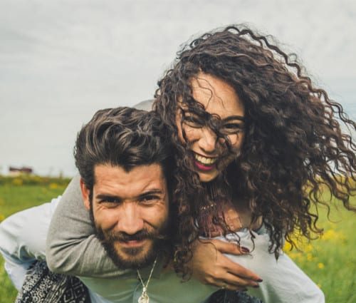 happy-couple-in-field